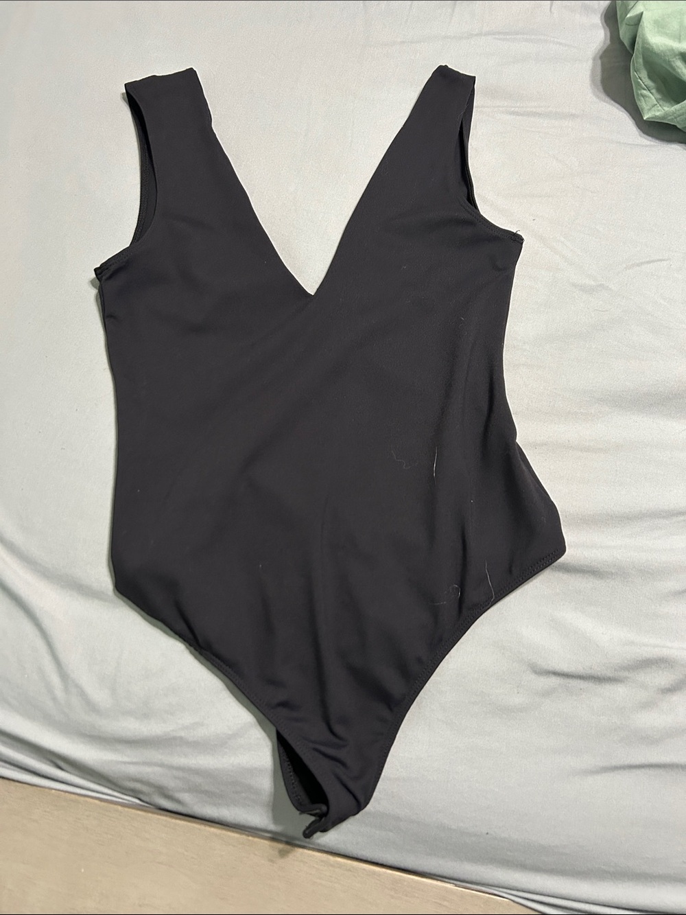Black plunge V-Neck One-Piece bodysuit